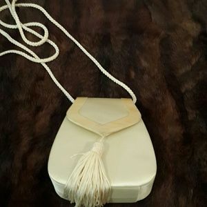 Cream evening bag with tassel